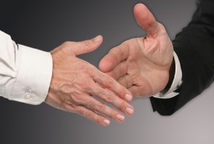 Men shaking Hands Closing a Deal